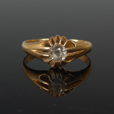 Lot 623 - An 18ct gold and single stone dress ring, size...
