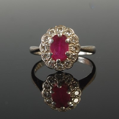 Lot 577 - A platinum, ruby and diamond cluster ring,...