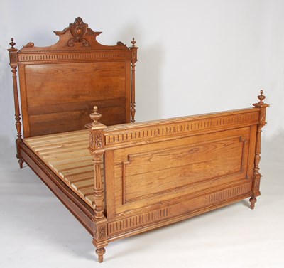 Lot 60 - An early 20th century oak double bed, the...