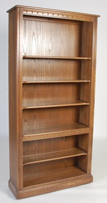 Lot 63 - An Ercol open bookcase, fitted with four...