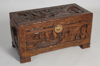 Lot 34 - A Chinese camphorwood blanket box, carved in...