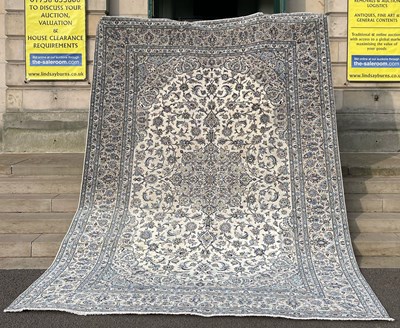 Lot 881 - A Persian Kashan carpet, the rectangular ivory...