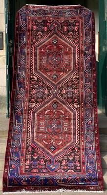 Lot 1007 - A Persian Zanjan long rug, the rectangular...