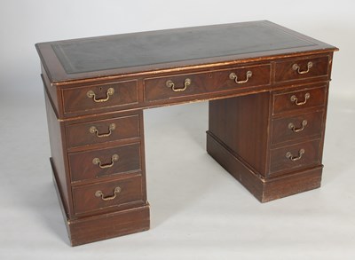 Lot 25 - A reproduction mahogany pedestal desk, the...
