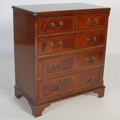 Lot 26 - A reproduction mahogany chest of two short...
