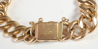 Lot 595 - A yellow metal curb-link bracelet, the clasp...