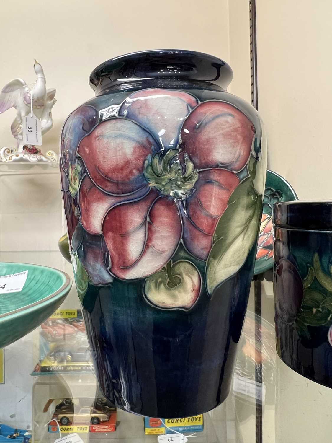 Lot 36 - A blue/ green ground Moorcroft pottery vase...