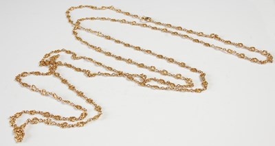 Lot 40 - A long yellow metal fancy-link guard chain,...