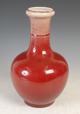 Lot 384 - A Chinese porcelain Sang-de-boeuf glazed vase,...