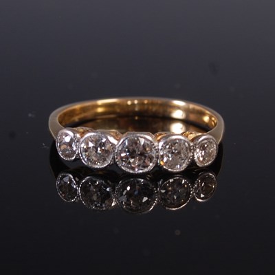 Lot 298 - A yellow and white metal five stone diamond...