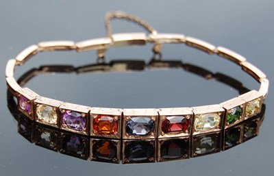 Lot 41 - A yellow metal and multi-gem set bracelet, set...