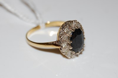 Lot 43 - A yellow metal sapphire and paste set dress ring