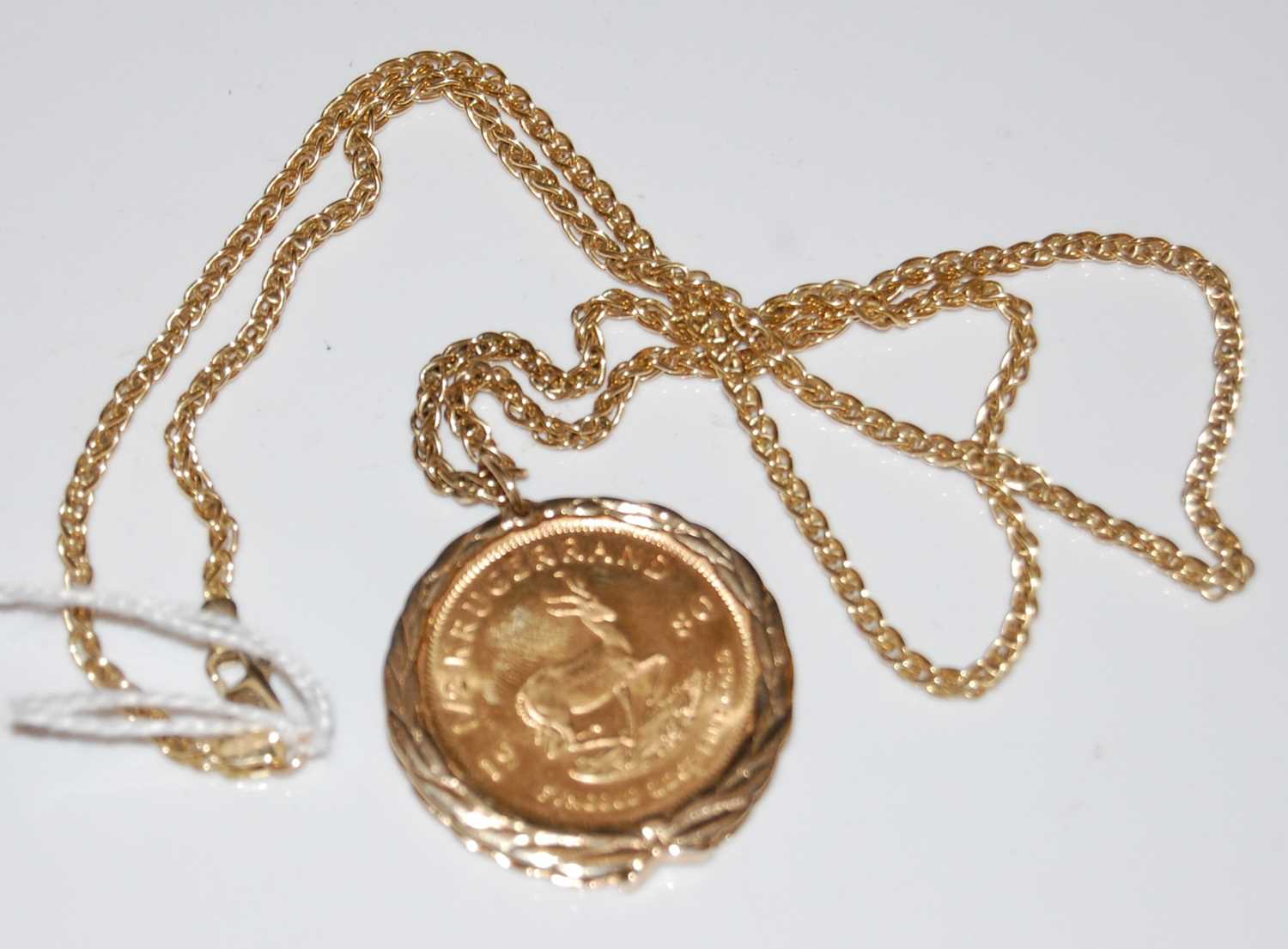 Lot 45 - A 1980 half-Krugerrand in 9ct gold mount...