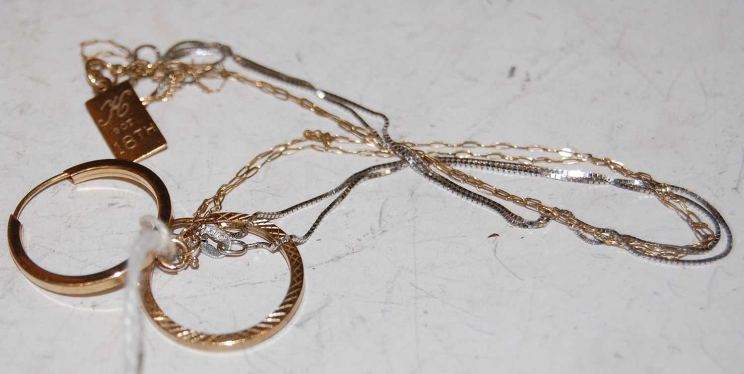 Lot 63 - A yellow metal necklace suspending a...