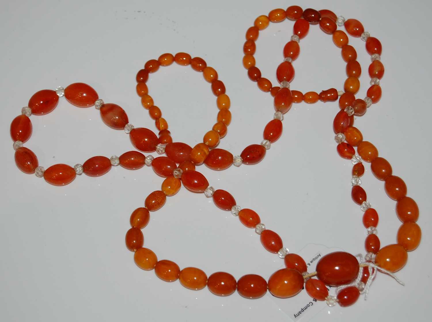 Lot 64 - A vintage amber butterscotch graduated bead...
