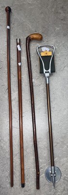 Lot 748 - A vintage shooting stick; a knobkerrie cane; a...