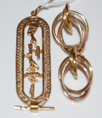 Lot 52 - A yellow metal Egyptian themed pendant, 7.5...