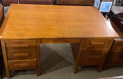 Lot 772 - A 20th century oak office desk, fitted with...