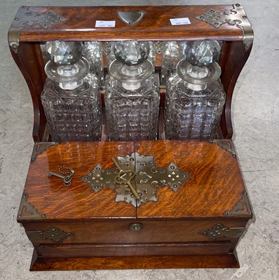 Lot 656 - A Victorian EP mounted oak three bottle mirror...