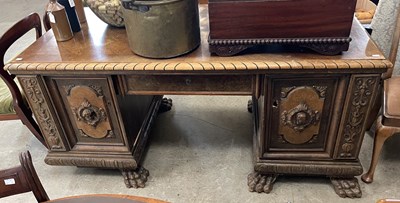 Lot 953 - An early 20th century walnut desk, the...