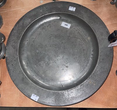 Lot 565 - An 18th century large pewter charger with...