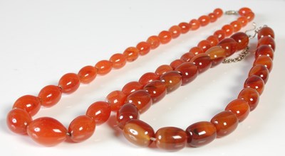 Lot 97 - Two polished agate bead necklaces.