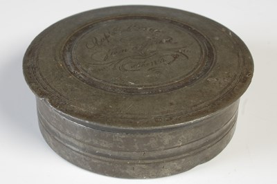 Lot 105 - A 19th century pewter circular box and cover,...