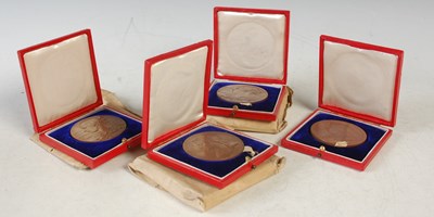 Lot 256 - A group of four bronze cased Queen Victoria...