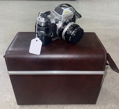 Lot 478 - A vintage Nikon SLR Nikkormat camera; together...