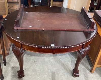 Lot 579 - A mahogany extending dining table, enclosing...
