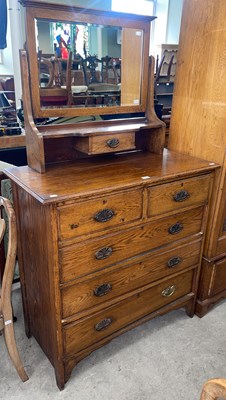 Lot 524 - An early 20th century ash mirror back dressing...