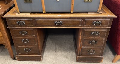 Lot 565 - A late 19th/ early 20th century oak pedestal...