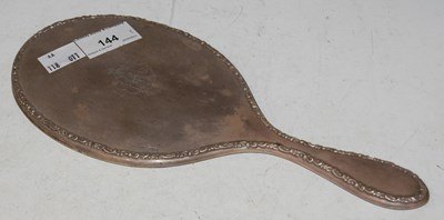 Lot 144 - A Birmingham silver backed hand-held dressing...
