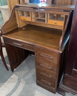 Lot 617 - A vintage oak roll-top desk, 91cm wide x 113cm...