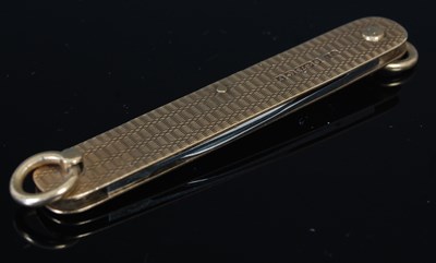 Lot 248D - A 9ct gold engine turned pen knife, with steel...