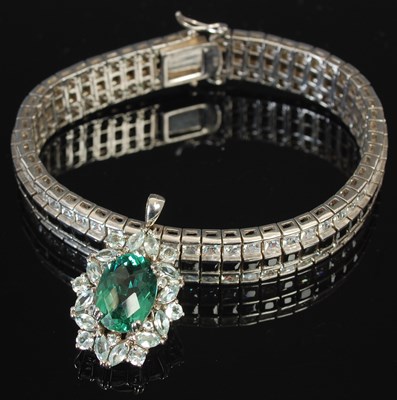 Lot 234B - A silver and paste set tennis type bracelet;...
