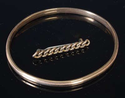 Lot 205 - A yellow metal bangle, stamped '9ct', 85.7mm...
