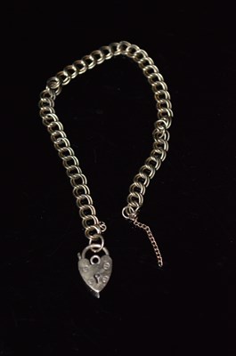 Lot 210 - A 9ct bracelet with a 9ct gold heart shaped...