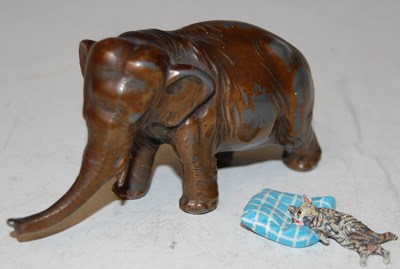 Lot 183 - A cold painted bronze model of a cat resting...