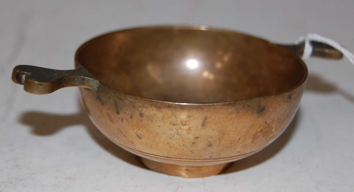 Lot 73 - An antique Scottish bronze quaich, 9.5cm wide