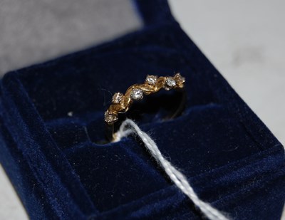 Lot 61D - An 18ct gold and diamond six stone zigzag ring