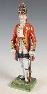 Lot 31 - A Dresden porcelain figure of an officer of...