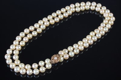 Lot 73 - A long single strand 9ct gold mounted pearl...