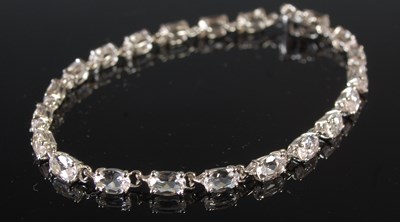 Lot 198 - A 9ct white gold and clear gem stone set...