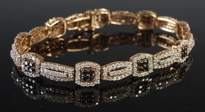 Lot 240 - A 9ct gold and gem set articulated bracelet,...