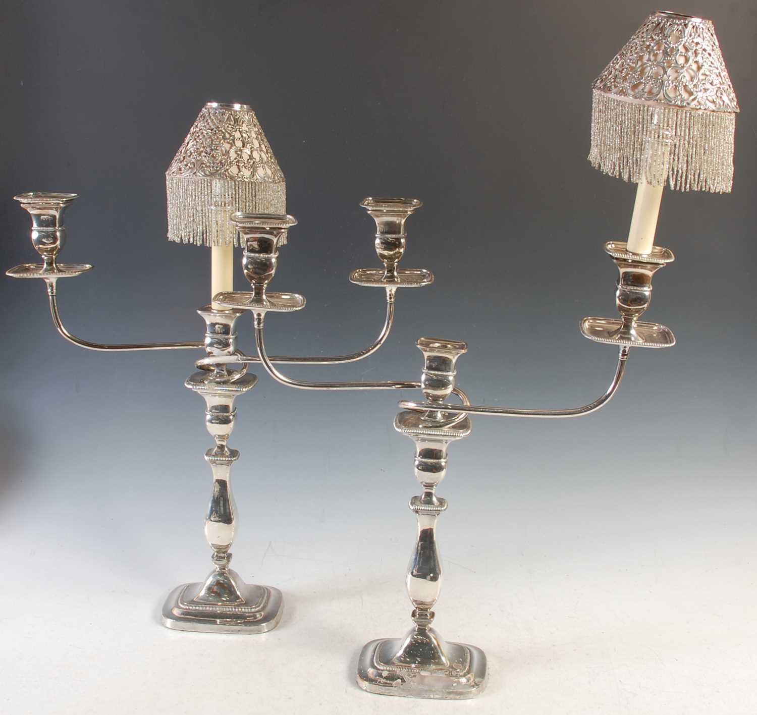 Lot 380 - A pair of three light electroplated candelabra,...