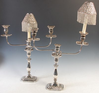 Lot 380 - A pair of three light electroplated candelabra,...