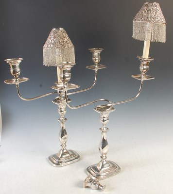 Lot 380 - A pair of three light electroplated candelabra,...