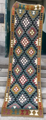 Lot 909 - A Maimana Kilim runner, the black and green...