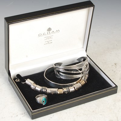 Lot 296A - Ogham, a silver bracelet set with various...